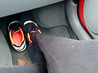 Girl with Nike airmax in car.